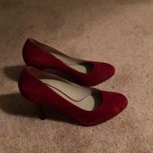 Suede almond toe pumps in a size 10.